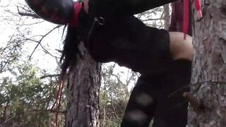 Tied up to a tree outdoor on sexy clothes and hard fucked