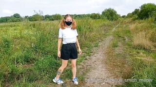 Bottomless Girl with Pigtails Walks along a Country Road