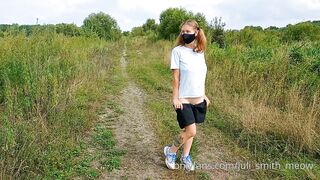 Bottomless Girl with Pigtails Walks along a Country Road