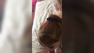 Sexy redhead sucks big cock while she gets fucked by her boyfriend in the ass