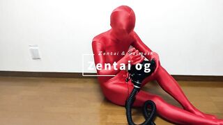 Respiratory control with gas mask on red zentai