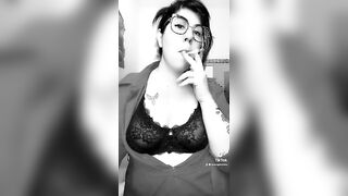 Sexy nerd girl smokes