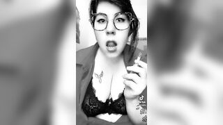 Sexy nerd girl smokes