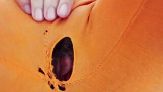 Indian girl working from home with hole in her pants. Under table view.