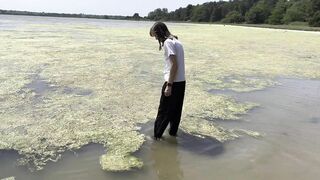 Wetlook down at the Estuary. Wearing black sports trousers and a white T-shirt