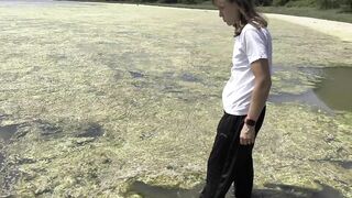 Wetlook down at the Estuary. Wearing black sports trousers and a white T-shirt