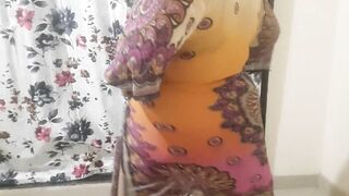 DESI HOT BHABHI GETTING READY FOR BEACH WEARING BIKINI INSIDE HER DRESS ..