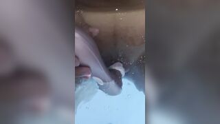 Jasmine masturbates the clitoris with a waterproof sex toy in the jaccuzy