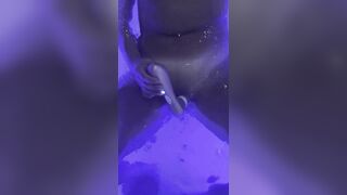 Jasmine masturbates the clitoris with a waterproof sex toy in the jaccuzy