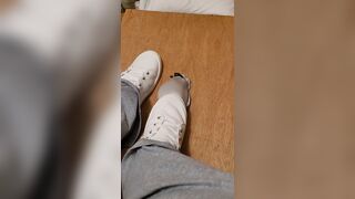 Rubbing his cock with white shoes