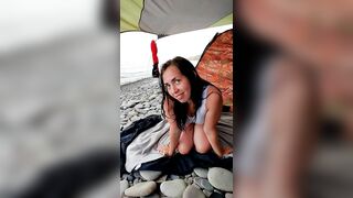 The languid look of a brunette on the beach