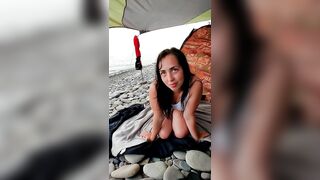 The languid look of a brunette on the beach