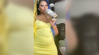 Sexy ebony teen drinking water and ducks on the straw