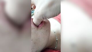 Sweetly sucks fingers and shows breasts