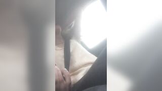 Beautiful junkie doing a shot in the car