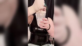 Girl in latex plays with cum