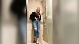 Girl showers in tight jeans