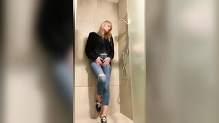 Girl showers in tight jeans