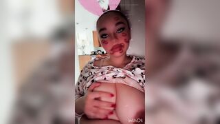 Bunny girl slut plays with her boobs