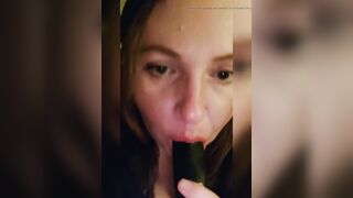 Sucking a big black dildo