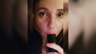 Sucking a big black dildo