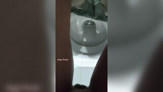 Girl peeing in the public toilet