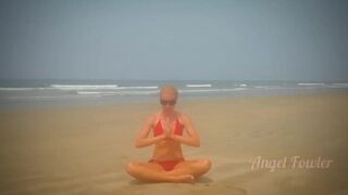 Beautiful Yoga Teacher having Tantra Practice on the Beach